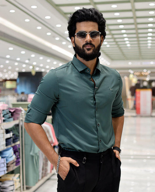 Green Solid Poly-Blended Formal Shirt Features Full Sleeves, a Slim Fit, a Spread Collar, and Regular Length