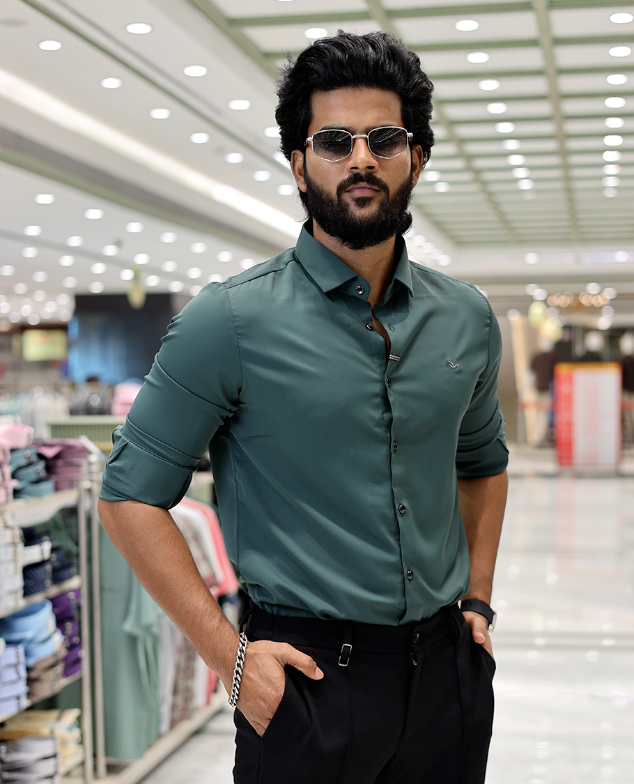 Green Solid Poly-Blended Formal Shirt Features Full Sleeves, a Slim Fit, a Spread Collar, and Regular Length