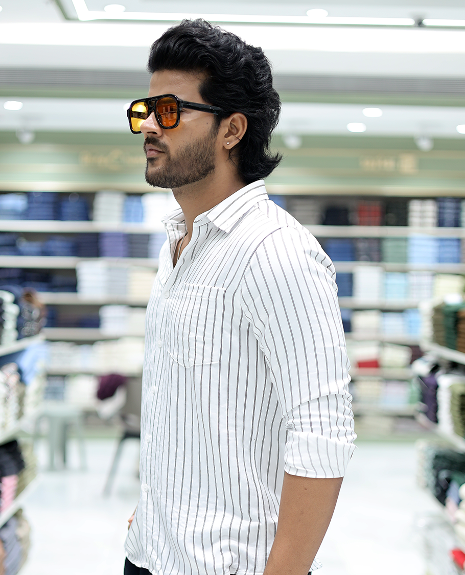 White Striped Poly-Blended Formal Shirt Comes with Full Sleeves, a Spread Collar, a Slim Fit, and a Regular Length