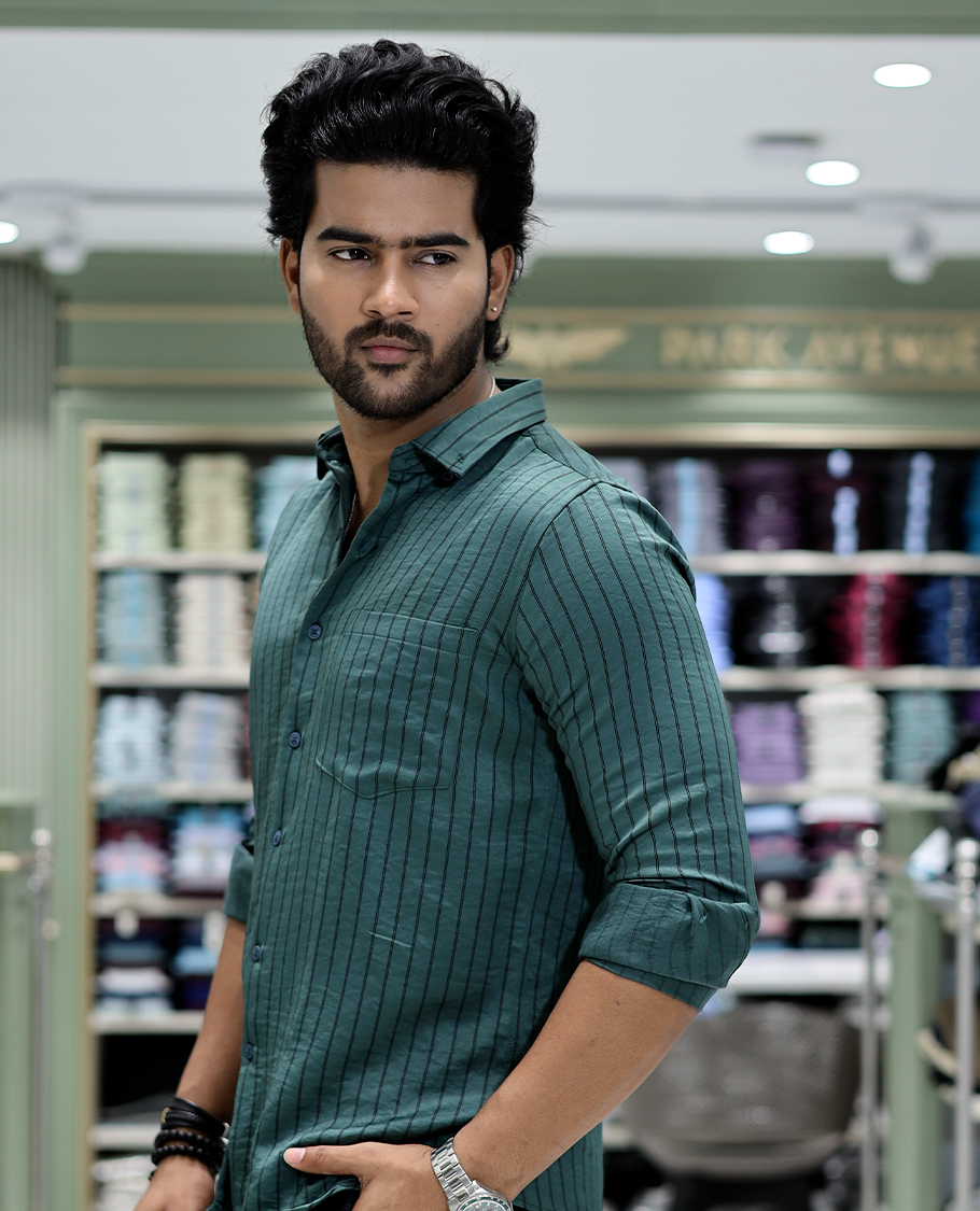 Green Striped Poly-Blended Formal Shirt Comes with Full Sleeves, a Spread Collar, a Slim Fit, and a Regular Length