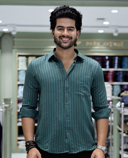 Green Striped Poly-Blended Formal Shirt Comes with Full Sleeves, a Spread Collar, a Slim Fit, and a Regular Length