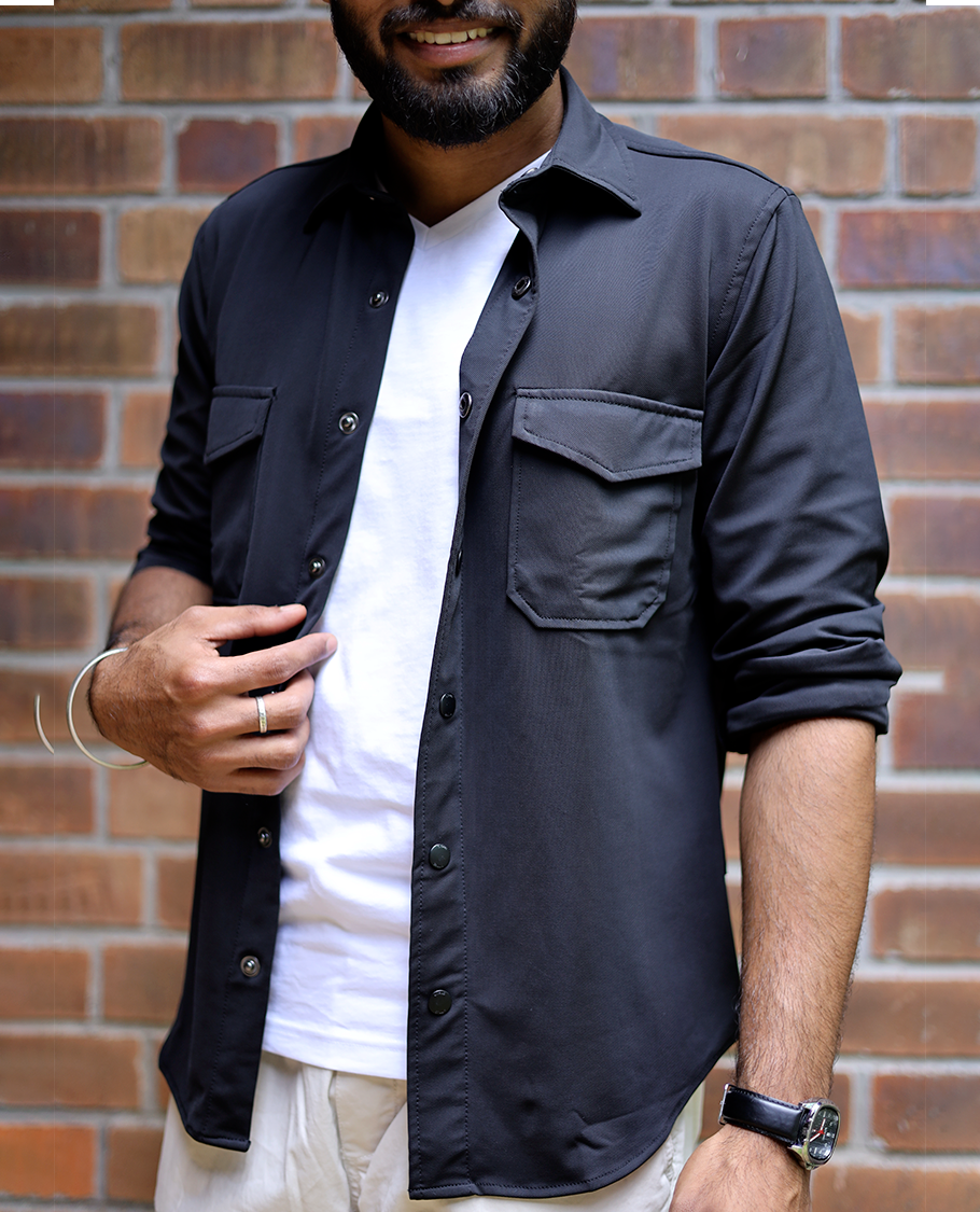 Black Solid Poly-Blended Casual Shirt Featuring Full Sleeves, a Spread Collar, a Slim Fit, and Regular Length