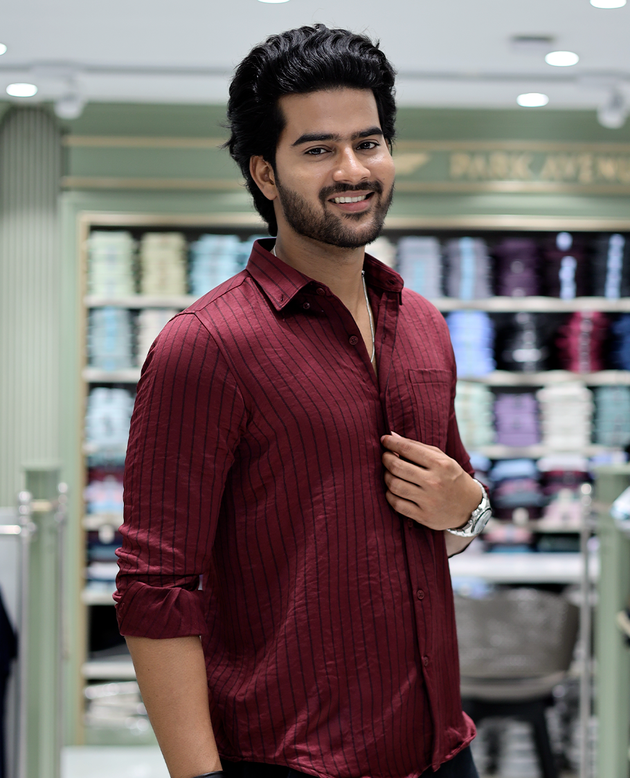 Maroon Striped Poly-Blended Formal Shirt Comes with Full Sleeves, a Spread Collar, a Slim Fit, and a Regular Length