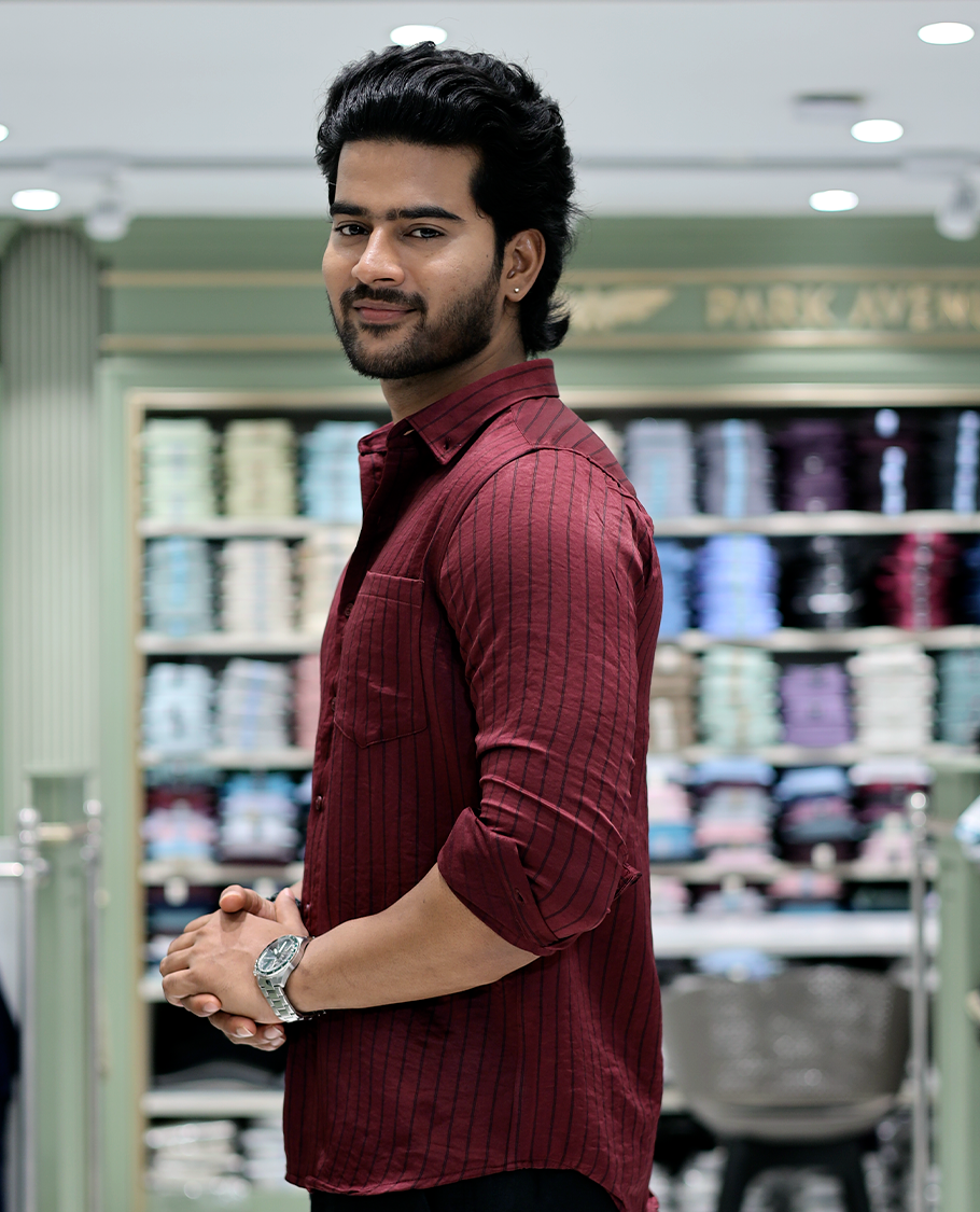 Maroon Striped Poly-Blended Formal Shirt Comes with Full Sleeves, a Spread Collar, a Slim Fit, and a Regular Length