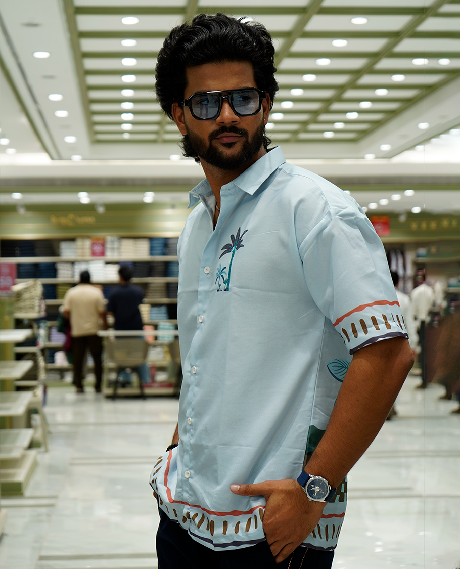 Light Blue Cotton-Blended Casual Shirt Features Tropical Flora Print, Full Sleeves, a Spread Collar, a Slim Fit, and a Regular Length