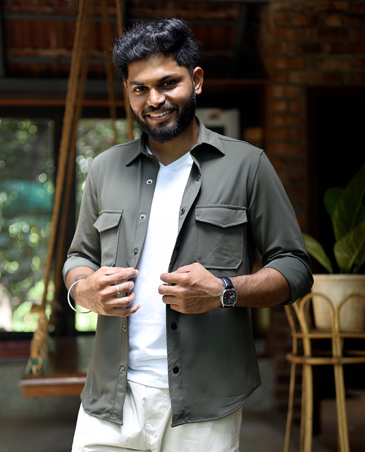 Green Solid Poly-Blended Casual Shirt Featuring Full Sleeves, a Spread Collar, a Slim Fit, and Regular Length