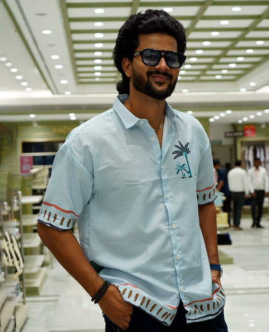Light Blue Cotton-Blended Casual Shirt Features Tropical Flora Print, Full Sleeves, a Spread Collar, a Slim Fit, and a Regular Length