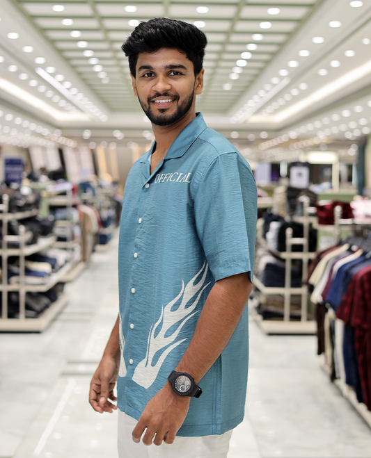 Blue Poly-Blended Causal Shirt, Comes with Fire Motifs Print, Half Sleeves, a Cuban Collar, a Boxy Fit, and Regular Length
