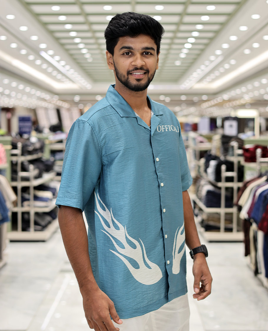 Blue Poly-Blended Causal Shirt, Comes with Fire Motifs Print, Half Sleeves, a Cuban Collar, a Boxy Fit, and Regular Length