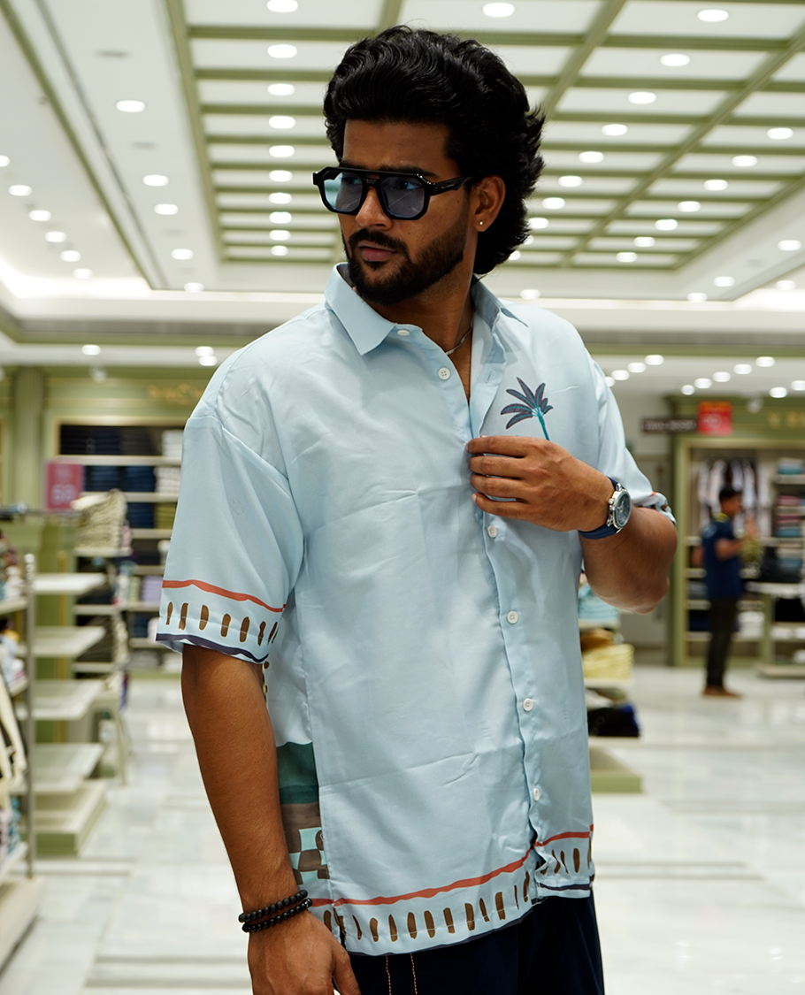 Light Blue Cotton-Blended Casual Shirt Features Tropical Flora Print, Full Sleeves, a Spread Collar, a Slim Fit, and a Regular Length