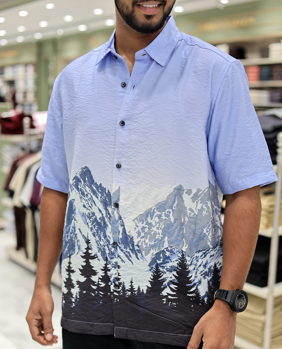 Blue Cotton-Blended Casual Shirt, Artfully Printed with Himalayan-Themed Snowfall Print, a Half-Sleeve, a Spread Collar, a Boxy Fit, and Regular Length