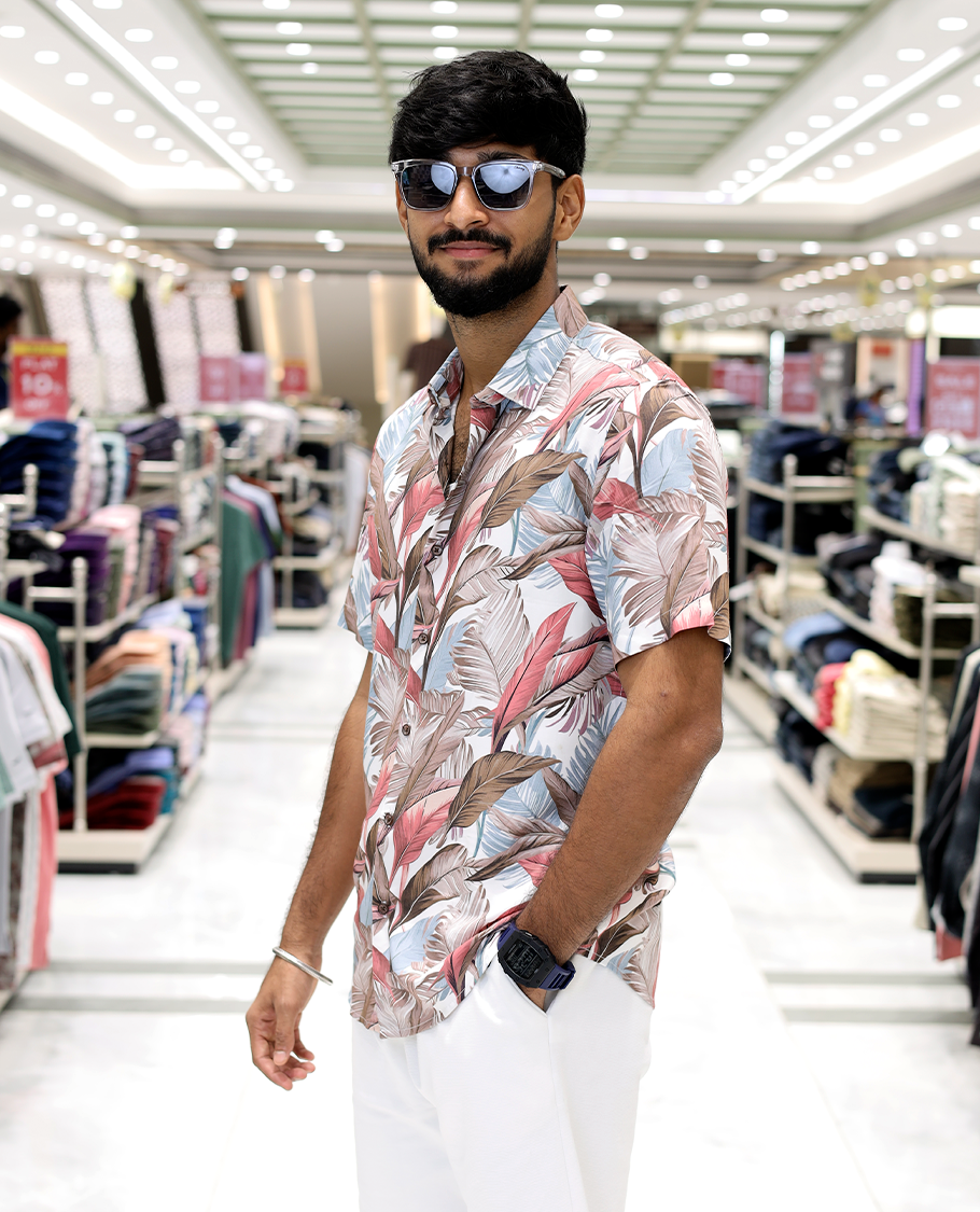 Pink Cotton-Blended Casual Shirt, Adorned with Tropical Floral Print, Half Sleeves, a Regular Fit, a Spread Collar, and Regular Length