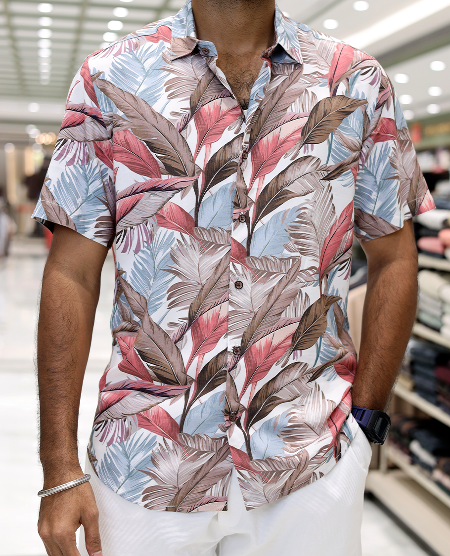 Pink Cotton-Blended Casual Shirt, Adorned with Tropical Floral Print, Half Sleeves, a Regular Fit, a Spread Collar, and Regular Length