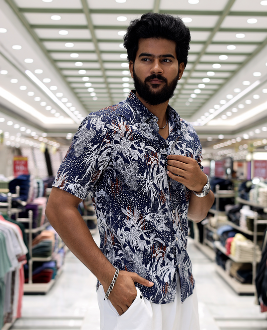 Blue Cotton-Blended Casual Shirt, Decked Up with Tropical Floral Print, Half Sleeves, a Regular Fit, a Spread Collar, and Regular Length