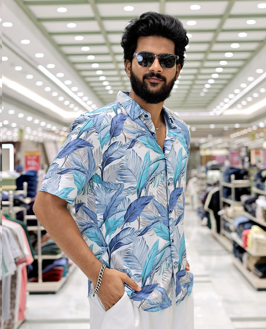 Blue Cotton-Blended Casual Shirt, Elevated with Tropical Floral Print, Half Sleeves, a Regular Fit, a Spread Collar, and Regular Length