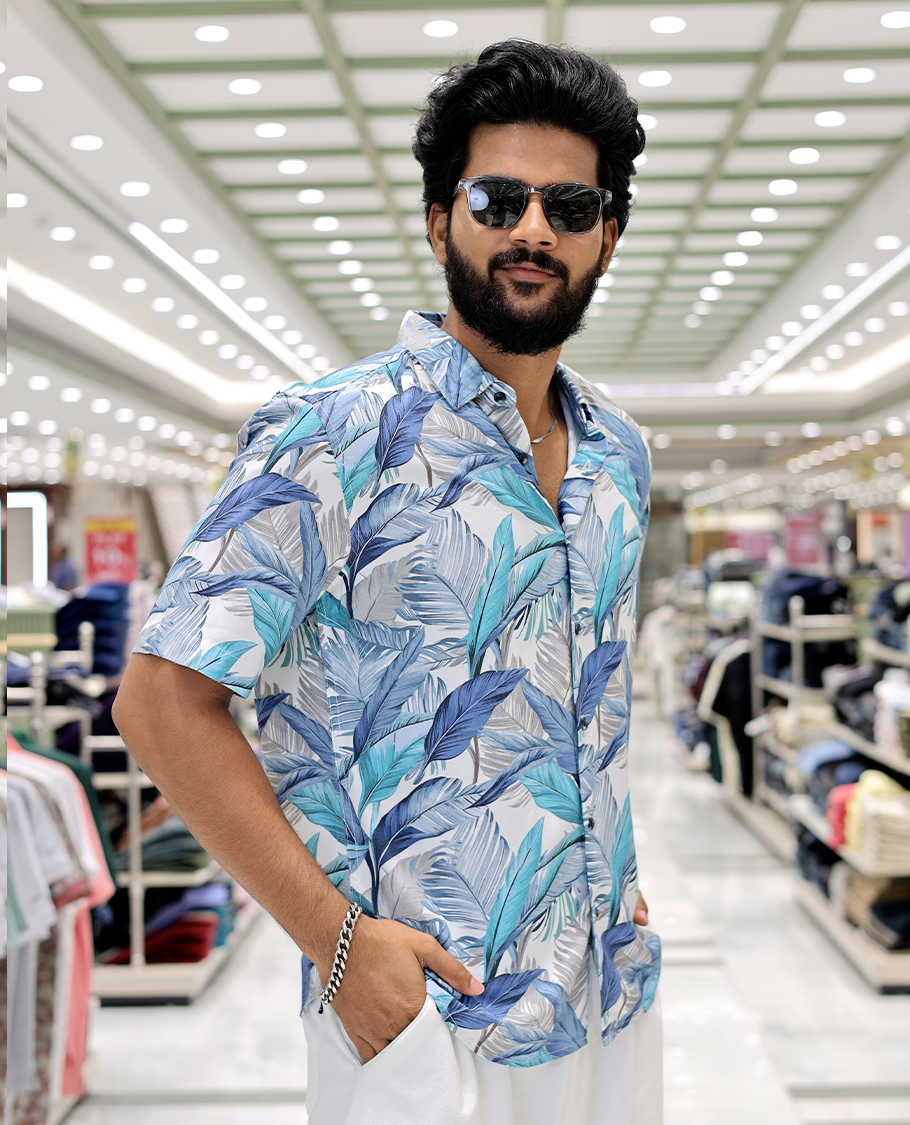 Blue Cotton-Blended Casual Shirt, Elevated with Tropical Floral Print, Half Sleeves, a Regular Fit, a Spread Collar, and Regular Length