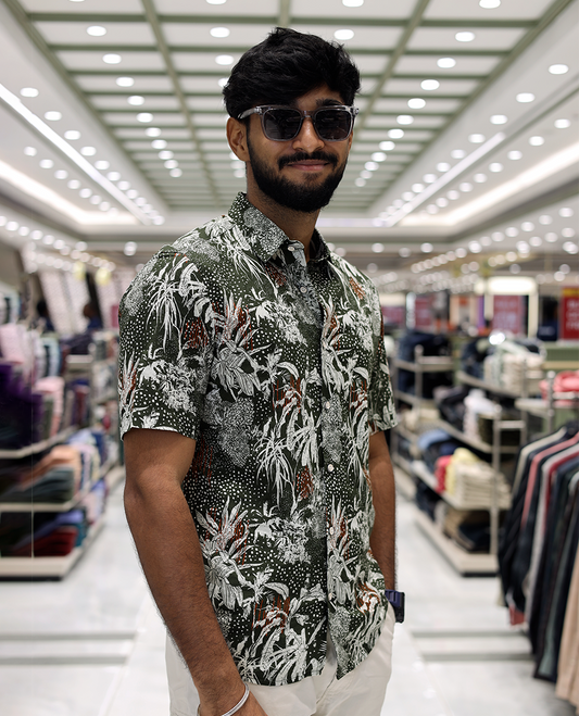 Green Cotton-Blended Casual Shirt, Accentuated with Tropical Floral Print, Half Sleeves, a Regular Fit, a Spread Collar, and Regular Length
