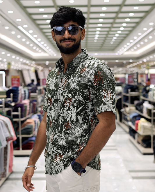 Green Cotton-Blended Casual Shirt, Accentuated with Tropical Floral Print, Half Sleeves, a Regular Fit, a Spread Collar, and Regular Length
