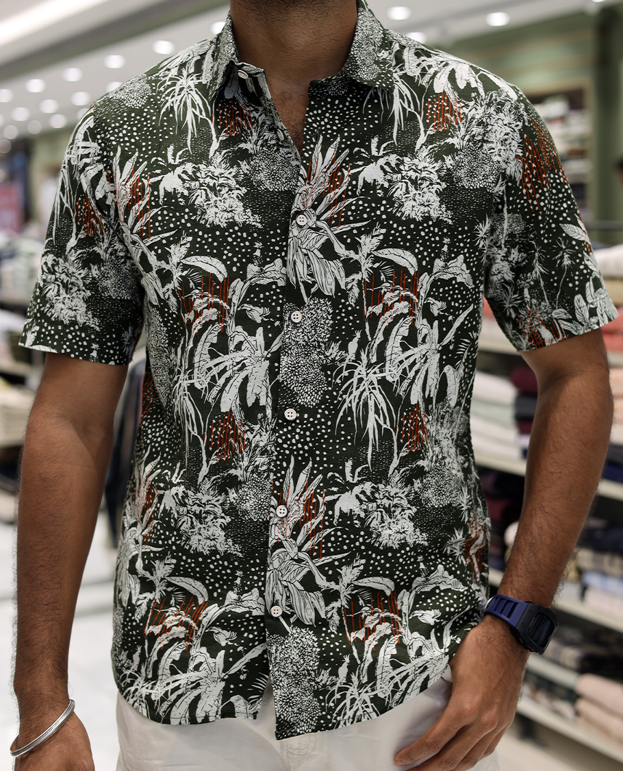 Green Cotton-Blended Casual Shirt, Accentuated with Tropical Floral Print, Half Sleeves, a Regular Fit, a Spread Collar, and Regular Length
