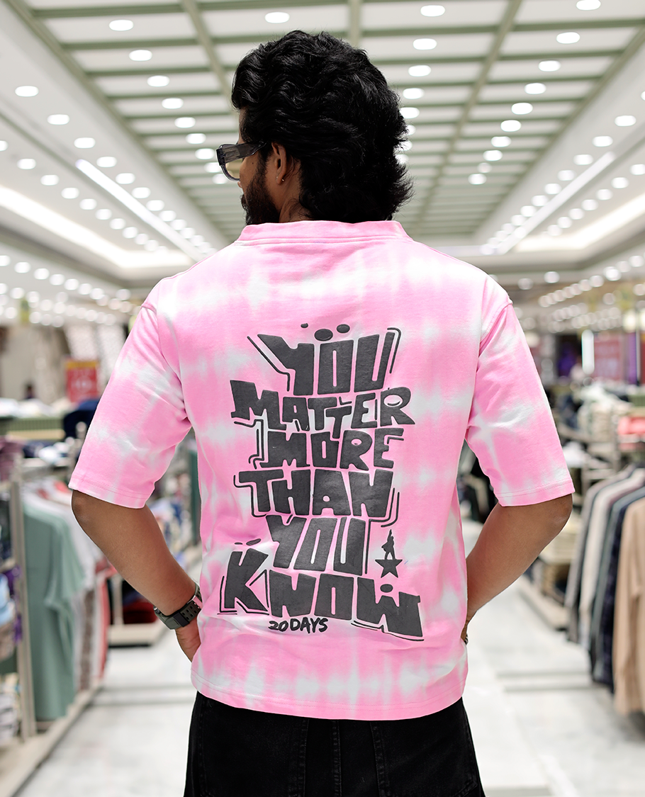 Pink Oversized Cotton-Blended T-Shirt Features an Abstract Dyed Typography Print, Half-Sleeves, Crew Neck, and Regular Length