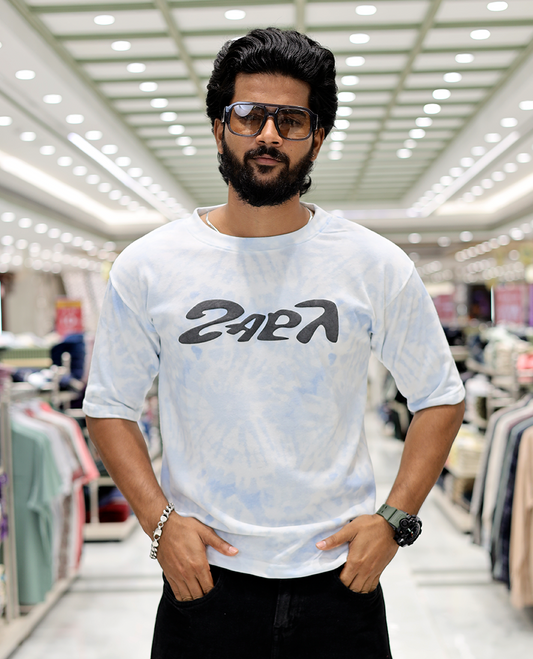 Light Blue Oversized Cotton-Blended T-Shirt Features an Abstract Dyed Typography Print, Half-Sleeves, Crew Neck, and Regular Length