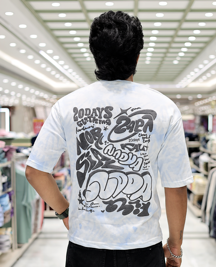 Light Blue Oversized Cotton-Blended T-Shirt Features an Abstract Dyed Typography Print, Half-Sleeves, Crew Neck, and Regular Length