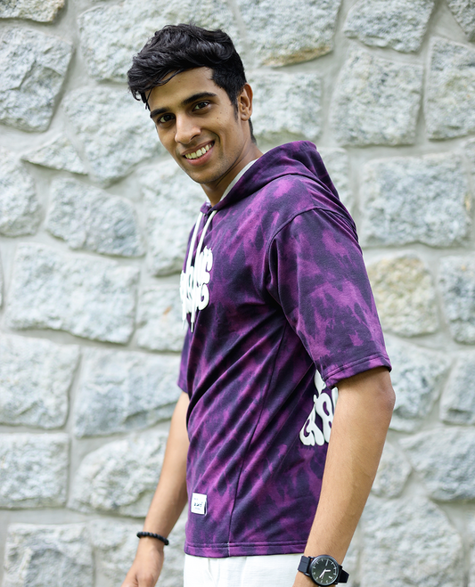 Purple Cotton-Blended Oversized Hooded T-Shirt Features Abstract Dyed Typography Print, Half-Sleeves, and Regular Length