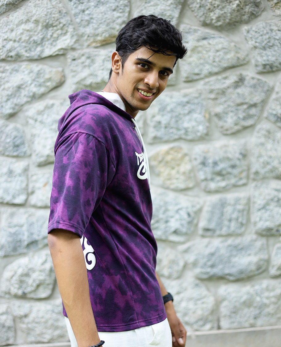 Purple Cotton-Blended Oversized Hooded T-Shirt Features Abstract Dyed Typography Print, Half-Sleeves, and Regular Length