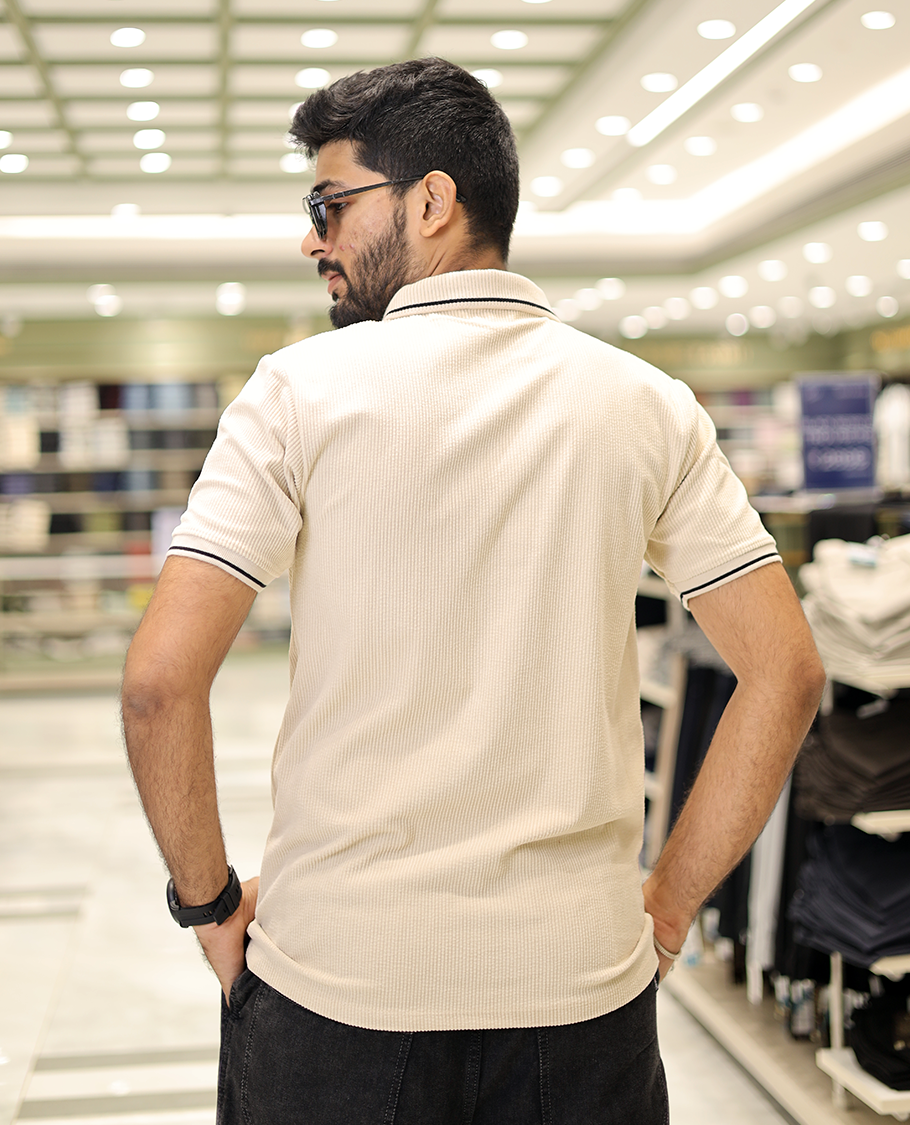 Cream Corduroy T-Shirt Comes with a Polo Neck, Half-Sleeves, a Slim Fit, and Regular Length
