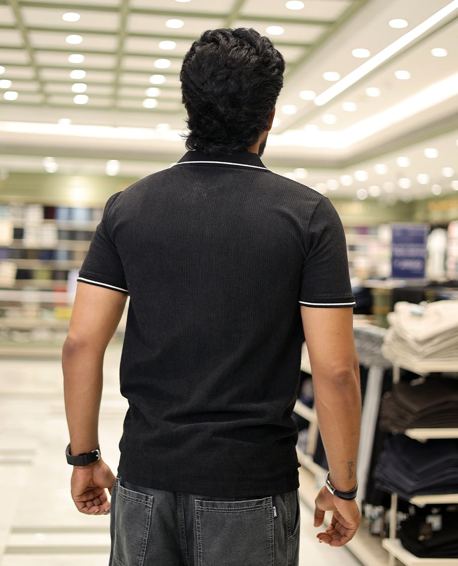 Black Corduroy T-Shirt Comes with a Polo Neck, Half-Sleeves, a Slim Fit, and Regular Length