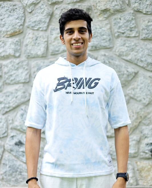 Light Blue Cotton-Blended Oversized Hooded T-Shirt Features Abstract Dyed Typography Print, Half-Sleeves, and Regular Length