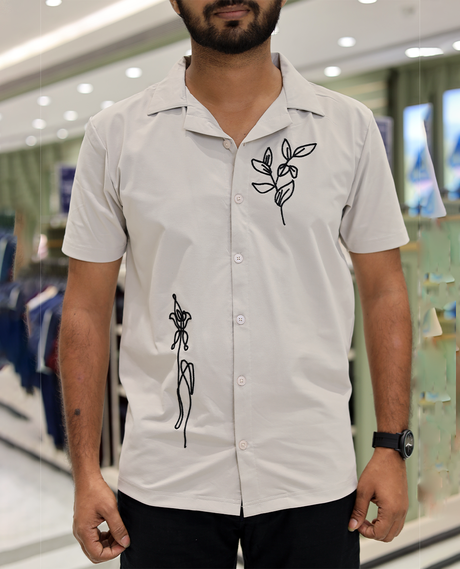 Cream Cotton-Blended Casual Shirt Comes with Leaf Motifs Outline Knitted Embroidery, Cuban Collar, Half Sleeves, Boxy Fit, and Regular Length