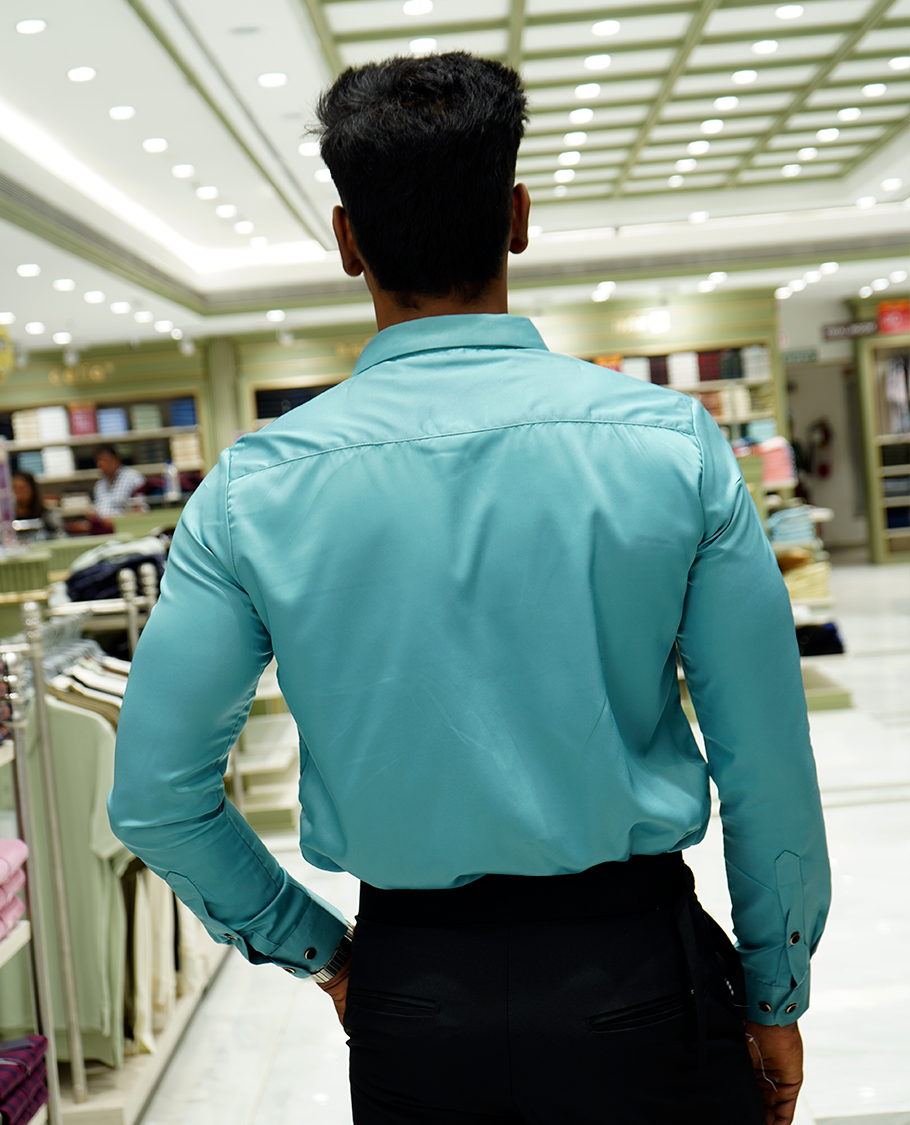 Teal Designer Party Wear Shirt Features Flower Work, a Spread Collar, Full Sleeves, a Slim Fit, and Regular Length