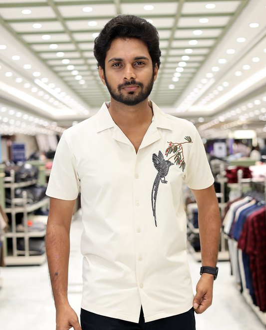 Cream Cotton-Blended Casual Shirt Comes with Humming Bird Motifs, Knitted Embroidery, Cuban Collar, Half Sleeves, Boxy Fit, and Regular Length
