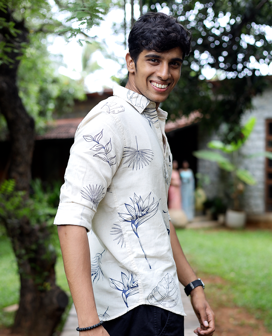 Cream Cotton-Blended Casual Shirt, Enthralled with Tropical Flora-themed Print, Full Sleeves, a Slim Fit, a Spread Collar, and a Regular Length