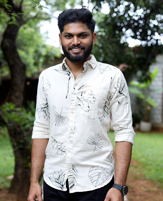 Cream Cotton-Blended Casual Shirt, Elevated with Tropical Flora-themed Print, Full Sleeves, a Slim Fit, a Spread Collar, and a Regular Length