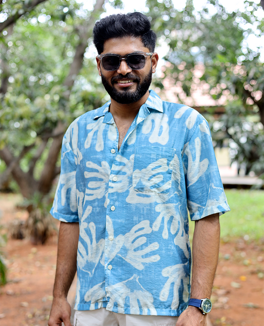 Blue Cotton-Blended Casual Shirt features an Abstract Print, Half Sleeves, Cuban Collar, Regular Fit, and Regular Length
