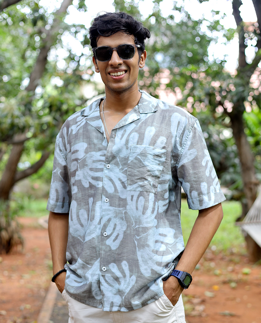 Brown Cotton-Blended Casual Shirt features an Abstract Print, Half Sleeves, Cuban Collar, Regular Fit, and Regular Length