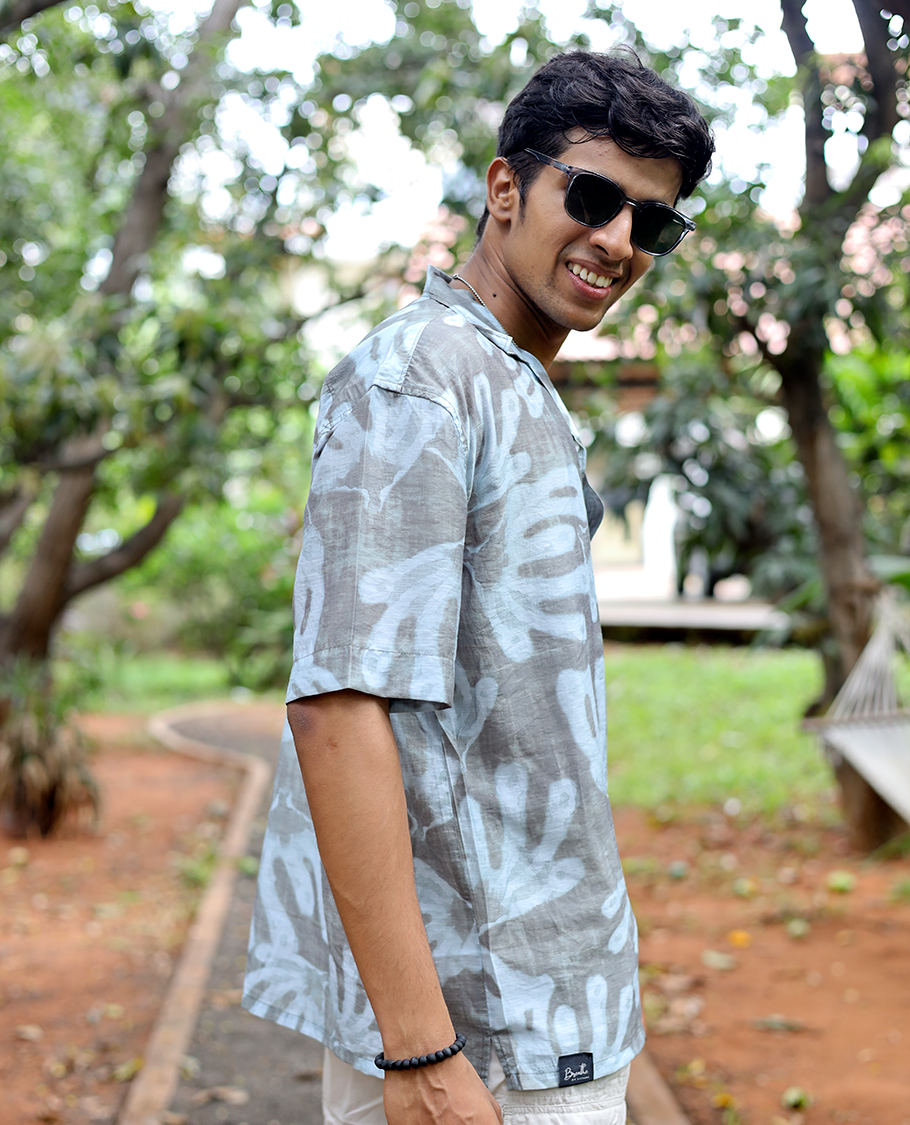 Brown Cotton-Blended Casual Shirt features an Abstract Print, Half Sleeves, Cuban Collar, Regular Fit, and Regular Length