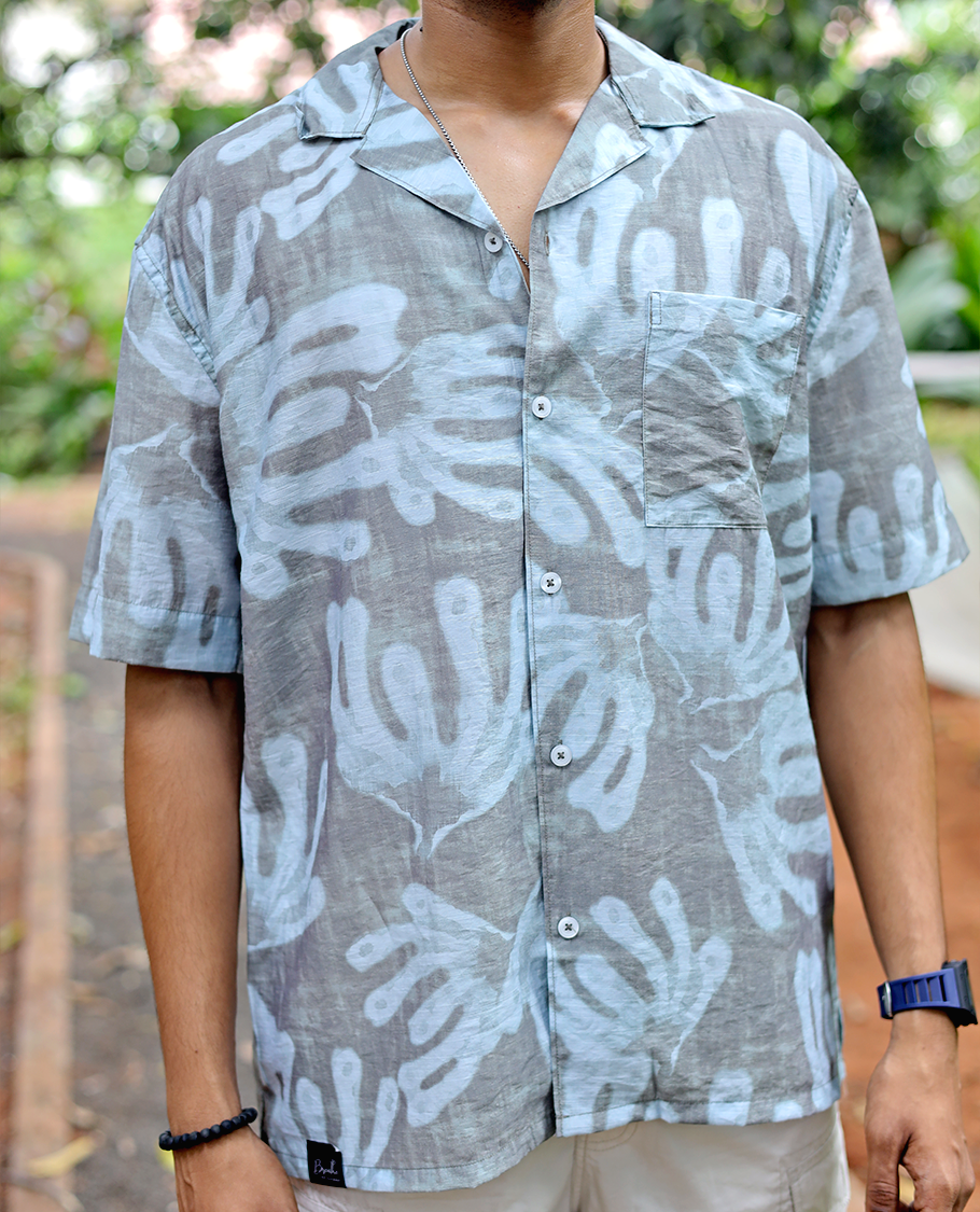 Brown Cotton-Blended Casual Shirt features an Abstract Print, Half Sleeves, Cuban Collar, Regular Fit, and Regular Length