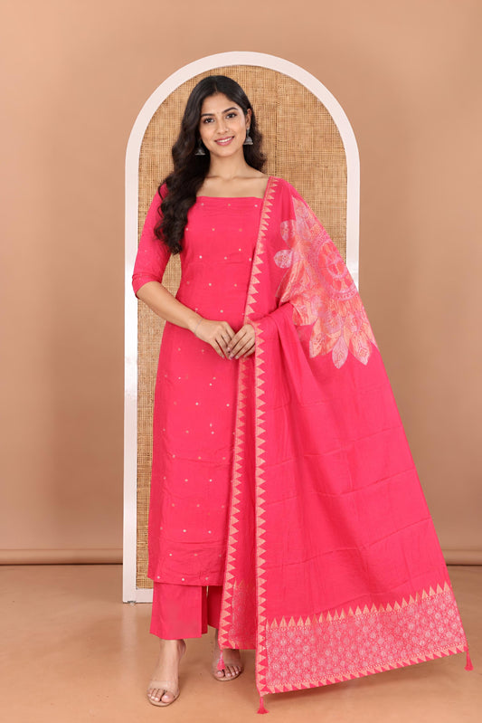 Pink Semi-Silk Material Churidar Features Zari Buttas Top, a Plain Bottom, and a Floral Motif Zari Woven Dupatta