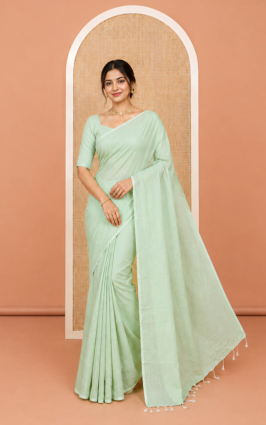 Borderless Pista Green Plain Khadi Cotton Saree, a Self-Pallu with Tassels, and a Matching Blouse