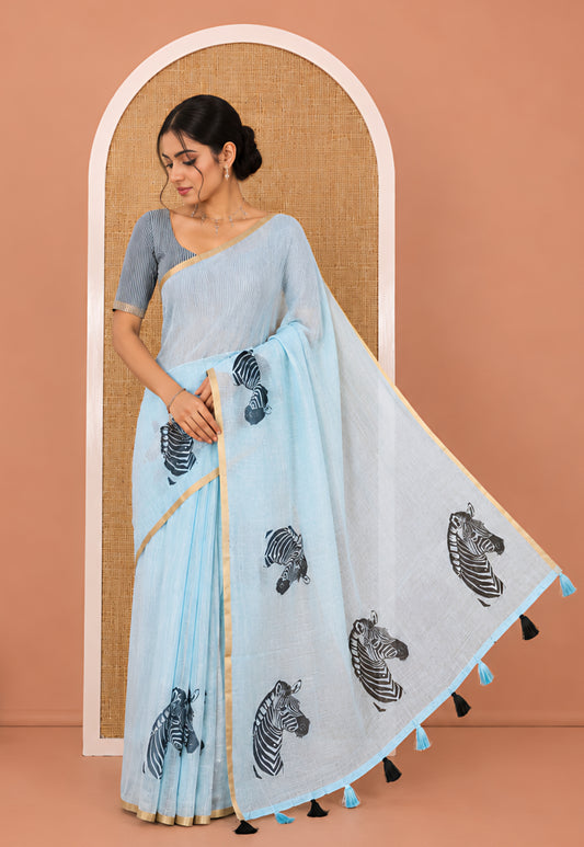 Sky Blue Linen Cotton Saree, Accentuated with Zebra Motifs Print, A Subtle Piping Border, Zebra Printed Pallu, and Comes with a Contrast Blouse