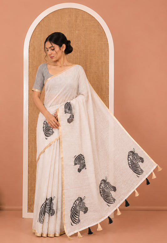 Chikku Linen Cotton Saree, Accentuated with Zebra Motifs Print, A Subtle Piping Border, Zebra Printed Pallu, and Comes with a Contrast Blouse