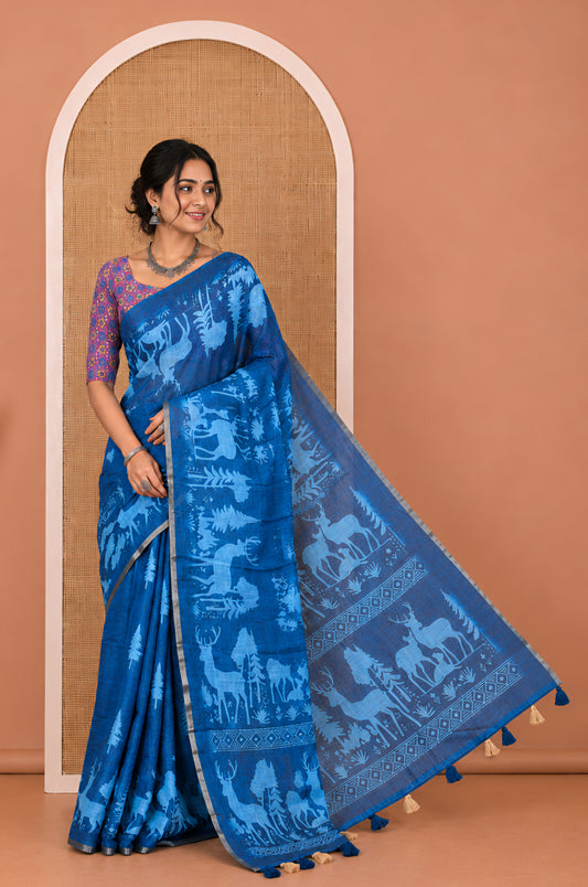 Blue Christmas-Themed Linen Cotton Saree, a Subtle Piping Border, a Christmas-Themed Print Pallu, a Contrast Blouse
