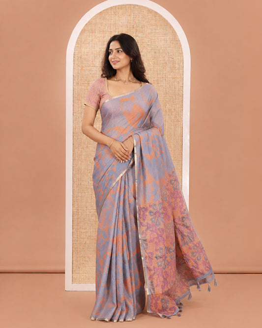 Grey Linen Cotton Saree, Detailed with Shibori Printed on Its Body, Subtle Piping Border, Pallu Features Floral Print, and Paired with a Contrast Floral Printed Blouse