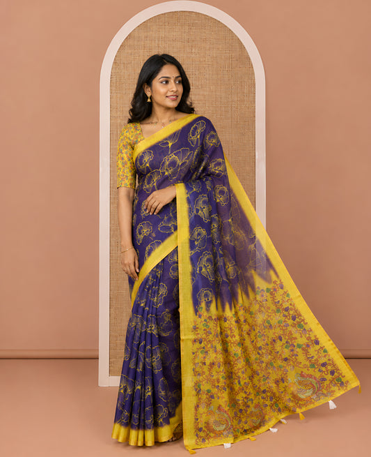 Royal blue floral printed linen cotton saree, contrast piping border, kalamkari floral and peacock printed pallu, and a contrast floral vine printed blouse