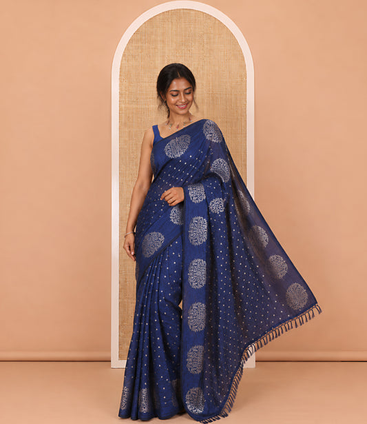 Navy blue plus buttas woven Vichitra silk saree, kalpavriksha tree motifs woven on its border, self-pallu, and no blouse