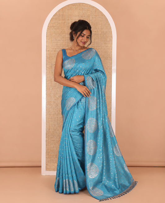 Light blue plus buttas woven Vichitra silk saree, kalpavriksha tree motifs woven on its border, self-pallu, and no blouse