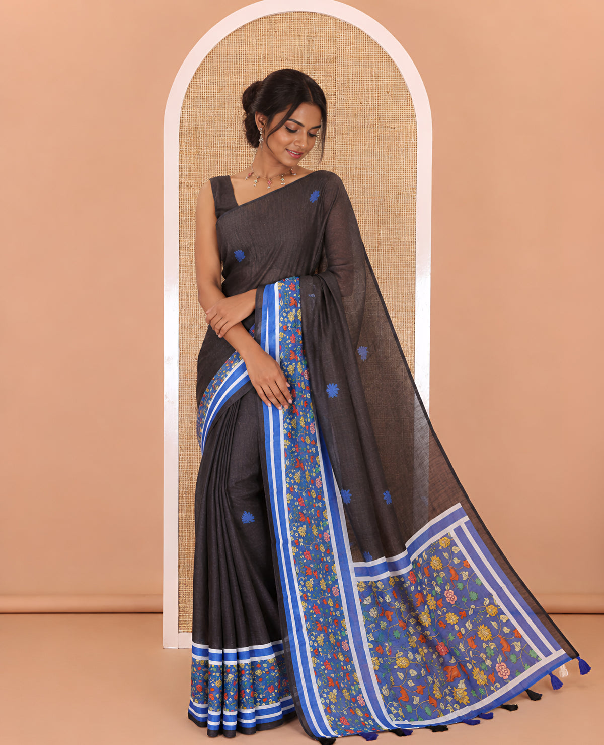 Black floral motifs printed linen cotton saree with contrast kalamkari floral vine printed border, floral vine printed pallu, and a plain blouse